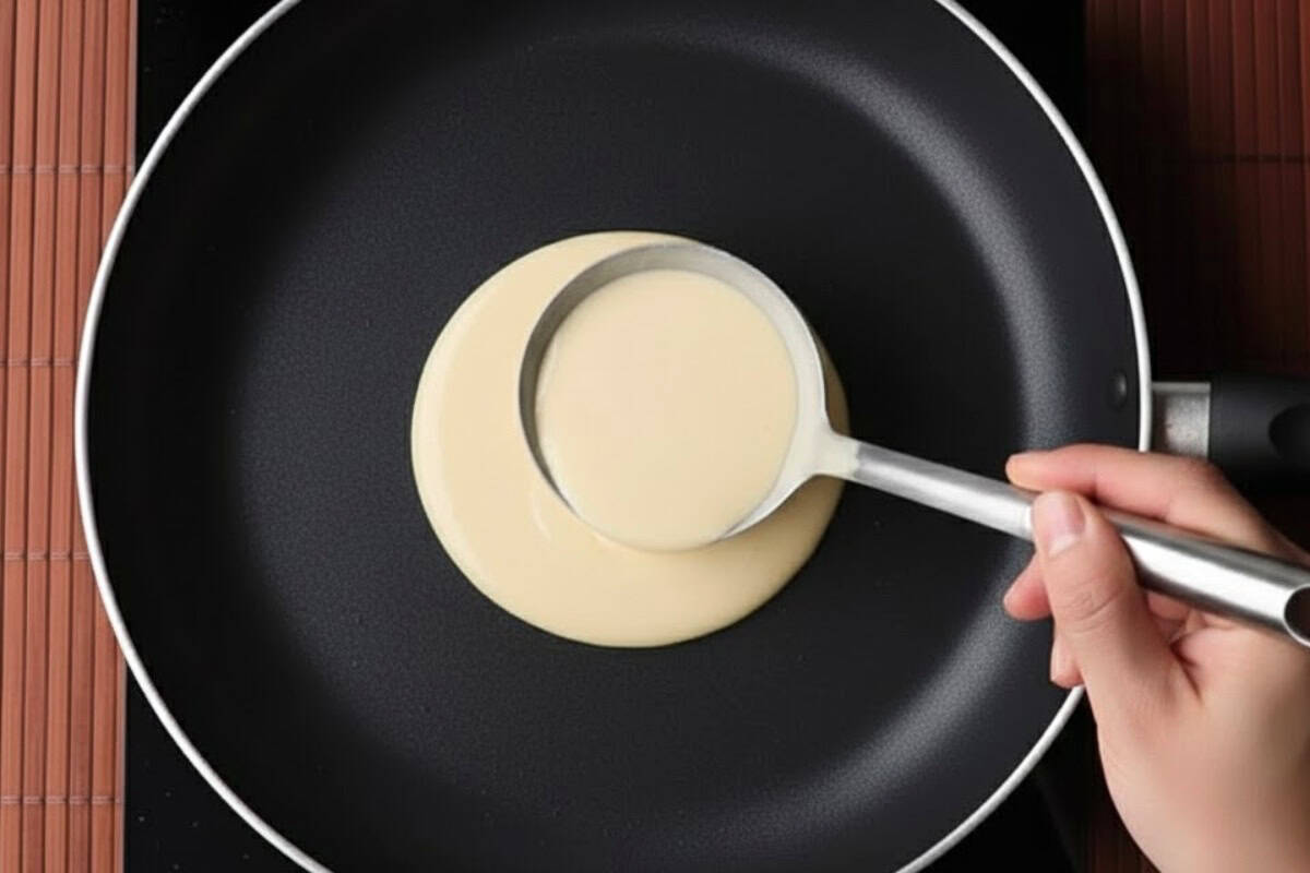 Pour about 2 tablespoons of batter into the center of the pan - 5