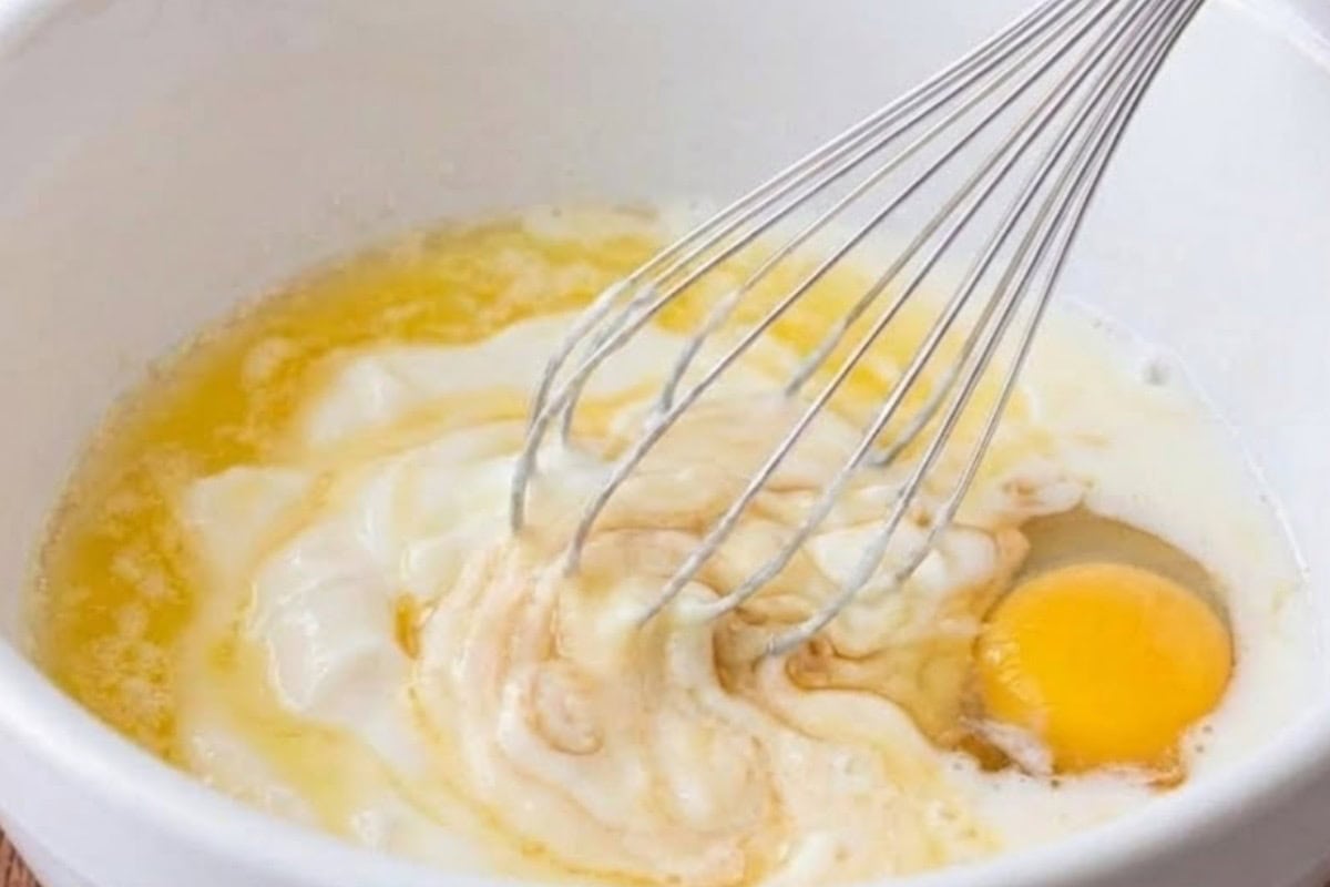 In a separate bowl, whisk the butter or oil, yoghurt, egg, vanilla, and milk until the mixture - 5