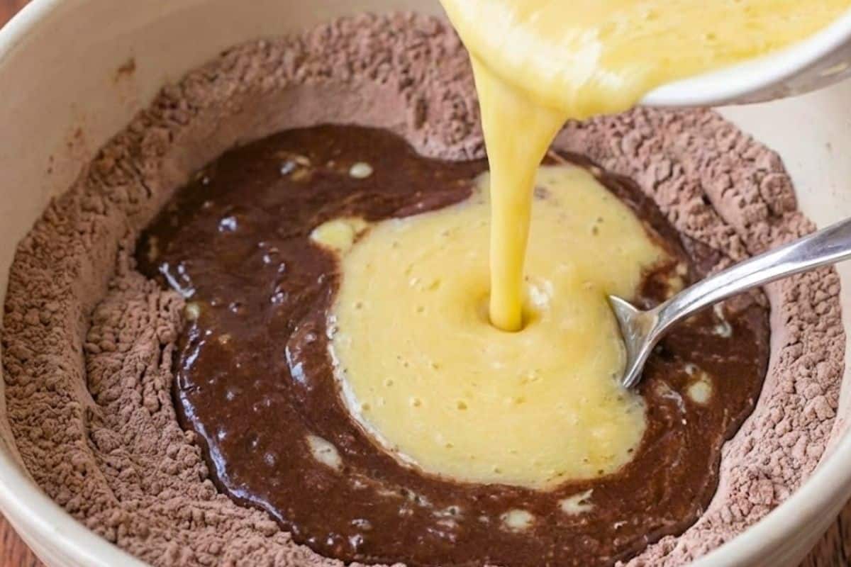 Pour the wet ingredients into the dry mixture and stir gently with a spoon - 6