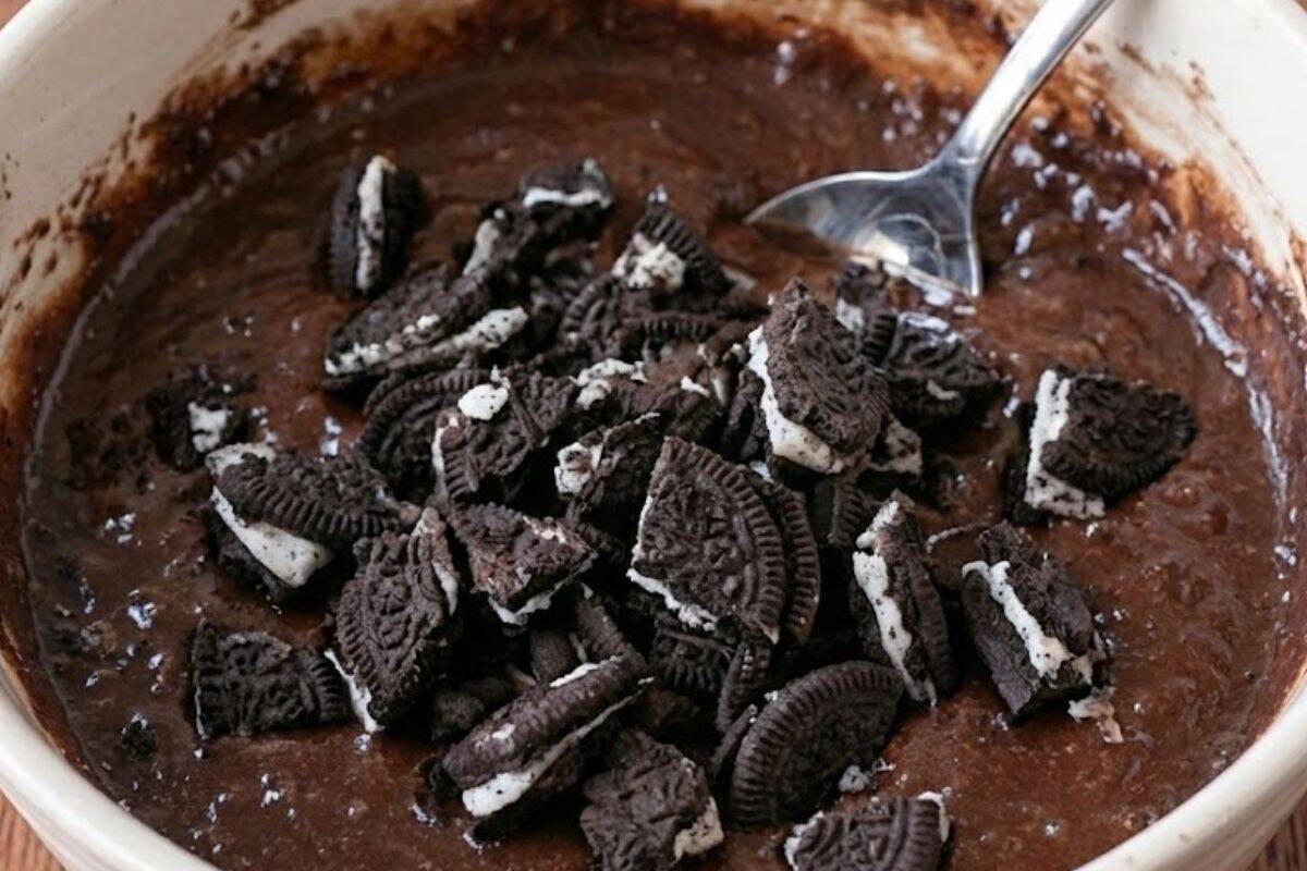 Add the crushed cookie pieces and fold them through the batter until they are evenly - 7