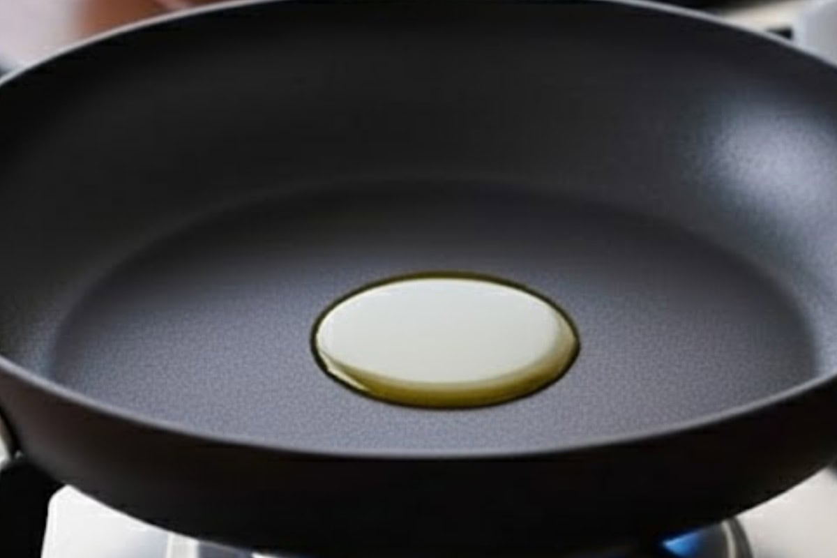 Warm the olive oil in a pan over medium heat until it shimmers slightly