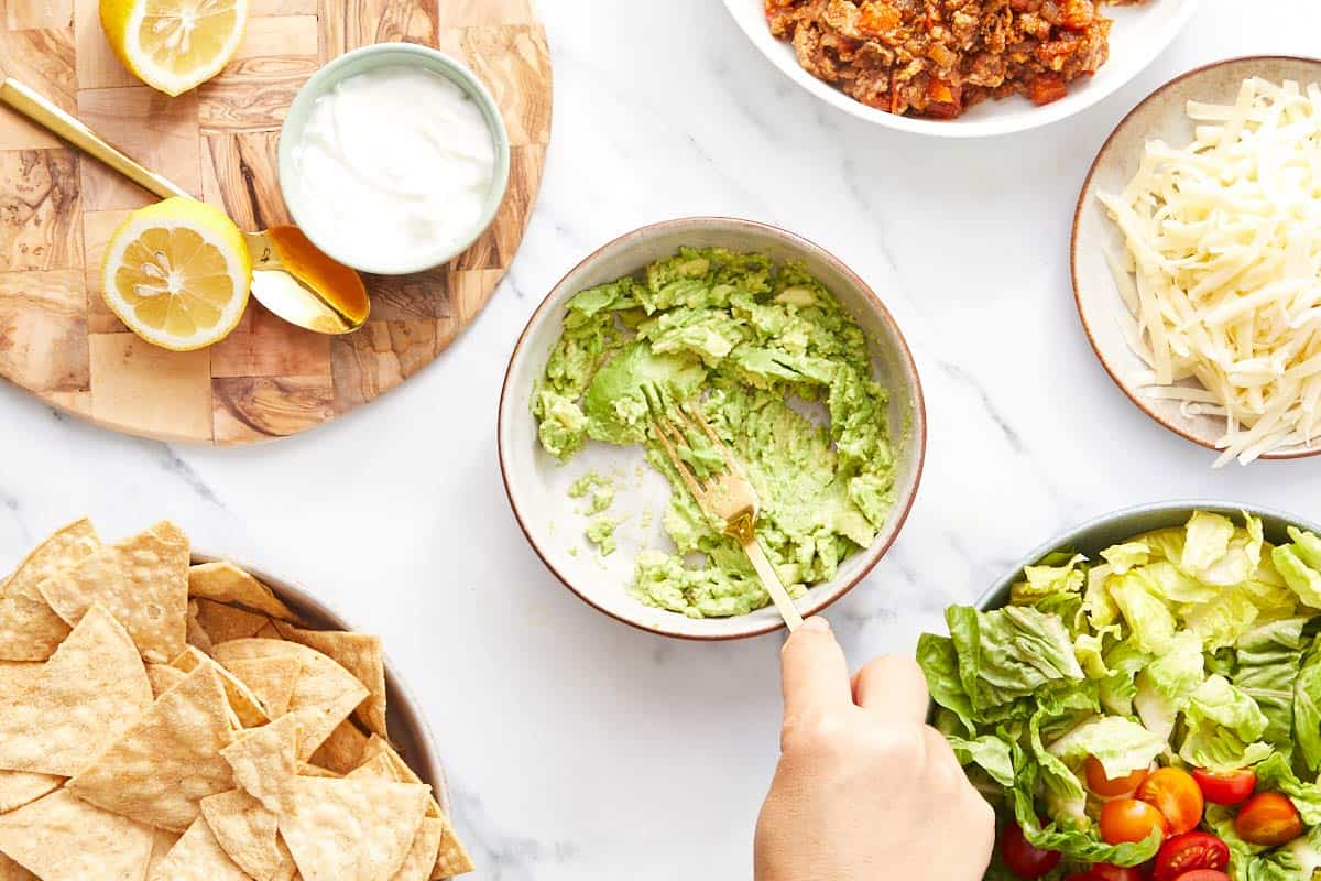 Avocado being smashed.