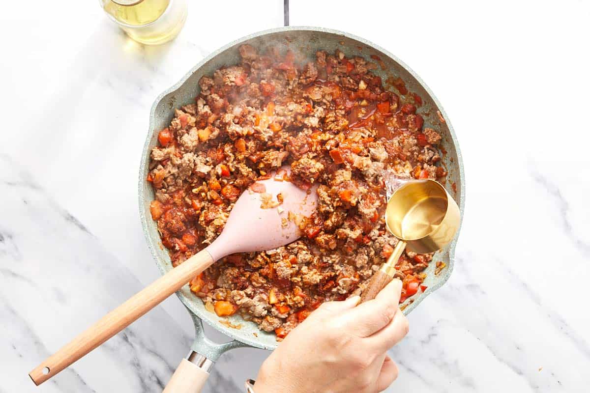 Mixed in the taco seasoning and water.