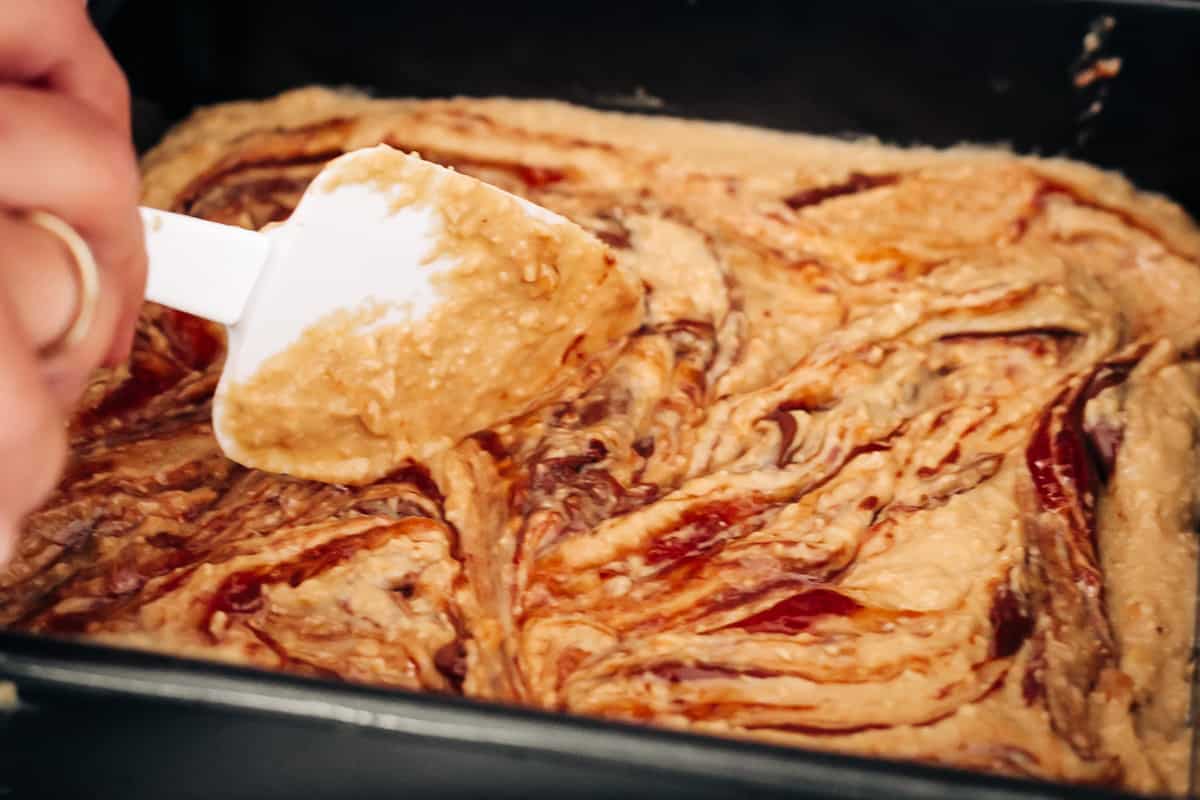 How to swirl jam and Nutella into blondie batter in a square baking tray