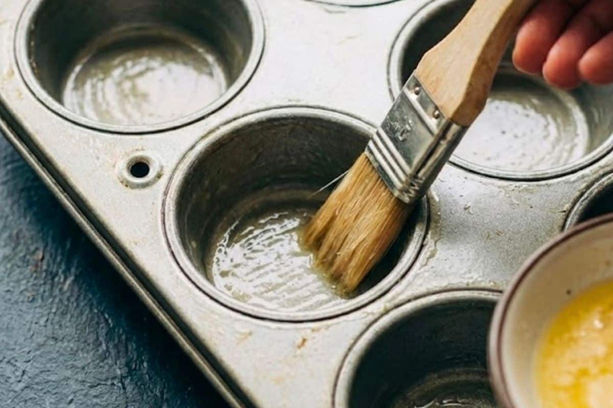 Lightly grease two muffin tins  - 4