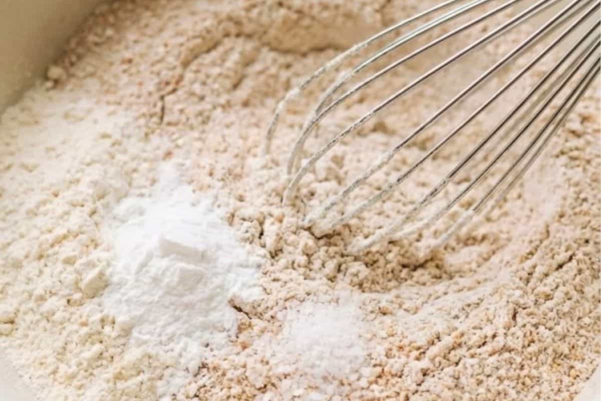 In a separate bowl, whisk together the whole wheat flour, all purpose flour, baking powder and salt - 8