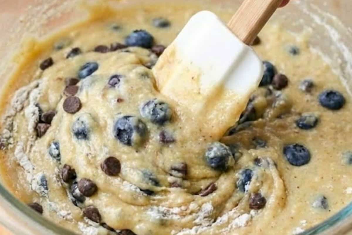 Gently fold in the blueberries and chocolate chips, distributing them evenly through the batter. - 7
