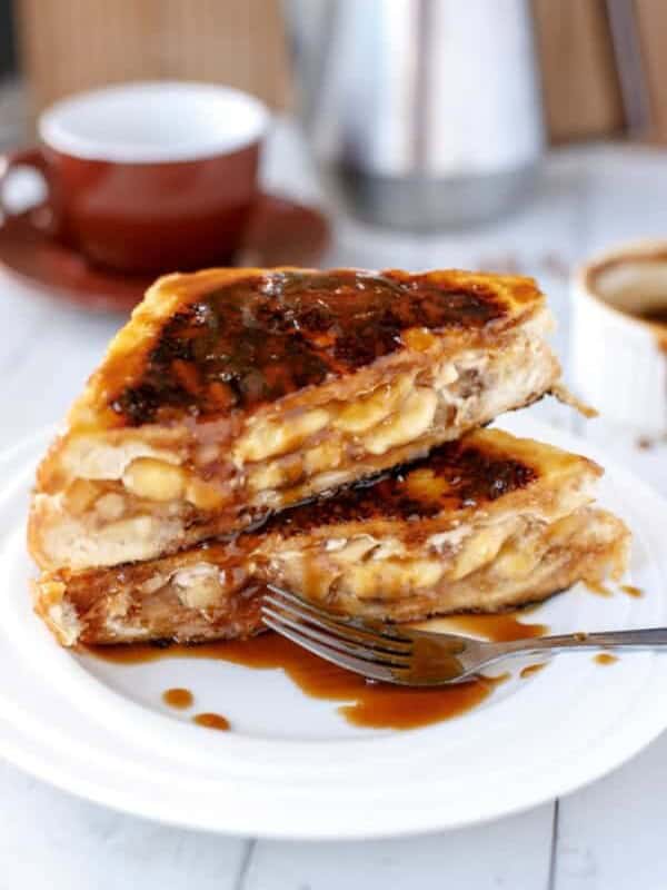 Banoffee French Toast with fork and some dressing aside