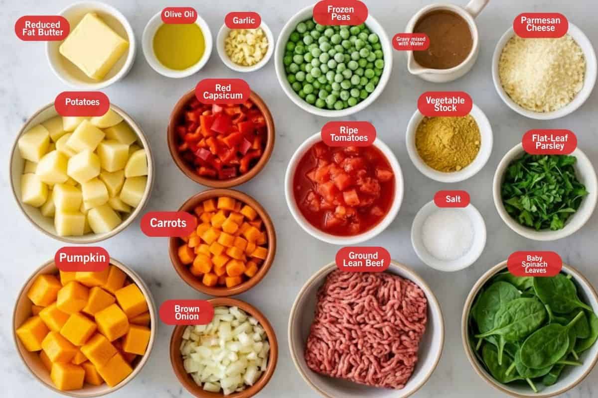 Flat lay photo of ingredient shot of reduced fat butter, olive oil, garlic, frozen peas, gravy mixed with water, parmesan cheese, vegetable stock, flat leaf parsley, baby spinach leaves, salt, ground lean beef, ripe tomatoes, carrots, pumpkin, brown onion, potatoes, red capsicum