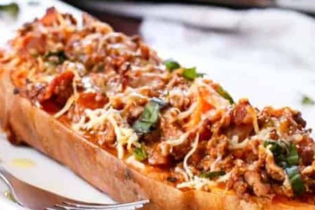 Spoon the mixture into the sweet potato shells, sprinkle with parmesan, then grill until the cheese melts and bubbles before finishing with fresh basil and serving. - 8