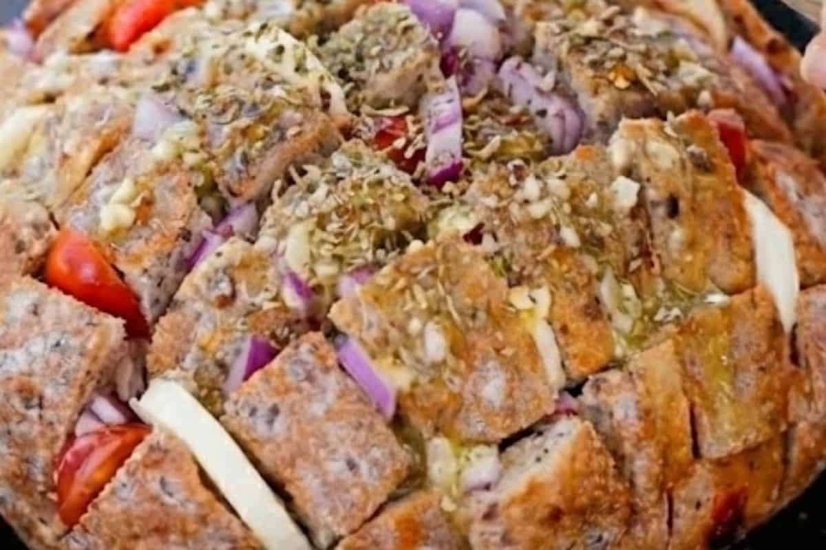 Sprinkle Italian pizza herbs all over the loaves