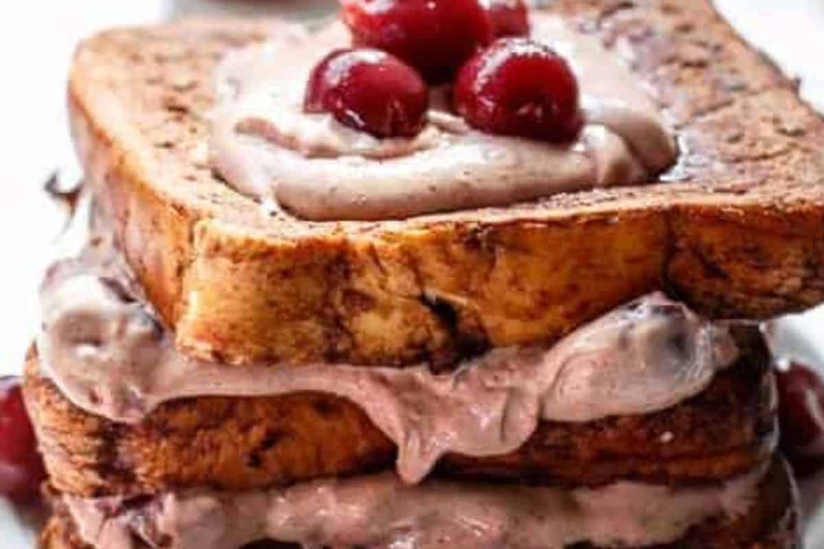 Layer the cooked French toast with the cheesecake filling and finish with a generous drizzle of chocolate maple syrup. - 8