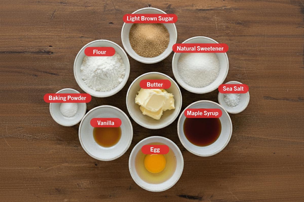 Top shot of ingredients: light brown sugar, natural sweetener, sea salt, maple syrup, egg, butter, flour, baking powder, and vanilla. - 2