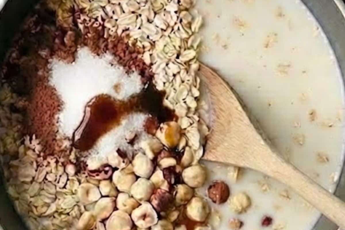 Add ingredients to a saucepan and boil. Reduce heat and simmer, stirring occasionally, until liquid is absorbed and oats are thick. Stir in milk. - 3