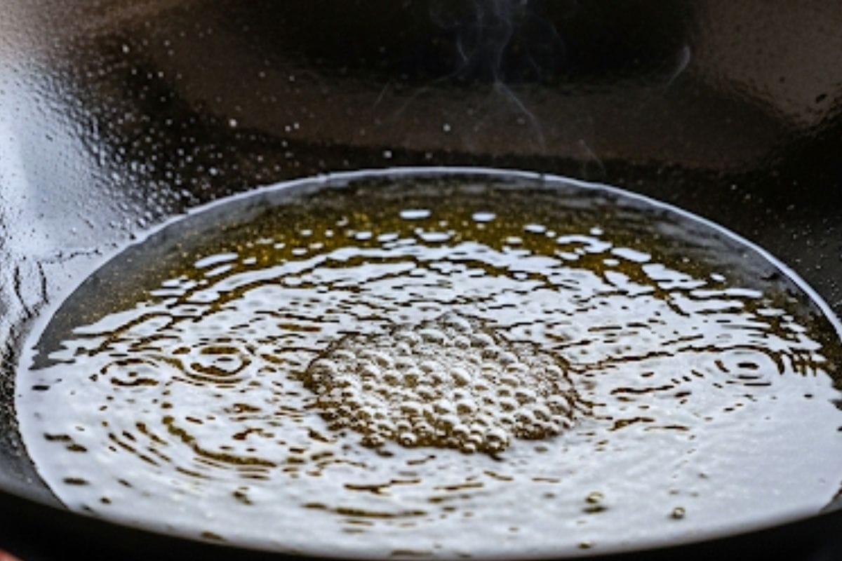 Add oil into a large wok