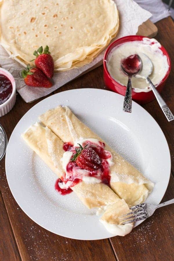 Fusing together a creamy cheesecake filling with juicy fresh strawberries and fluffy vanil Strawberry Cheesecake Crepes