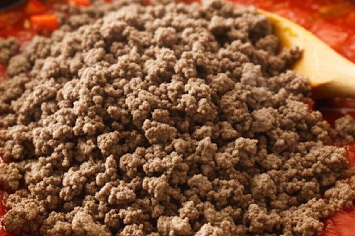 Add the ground beef and cook, breaking it up with a woodend spoon, until browned. Stir in tomato sauce, tomato paste, and vegetable stock powder