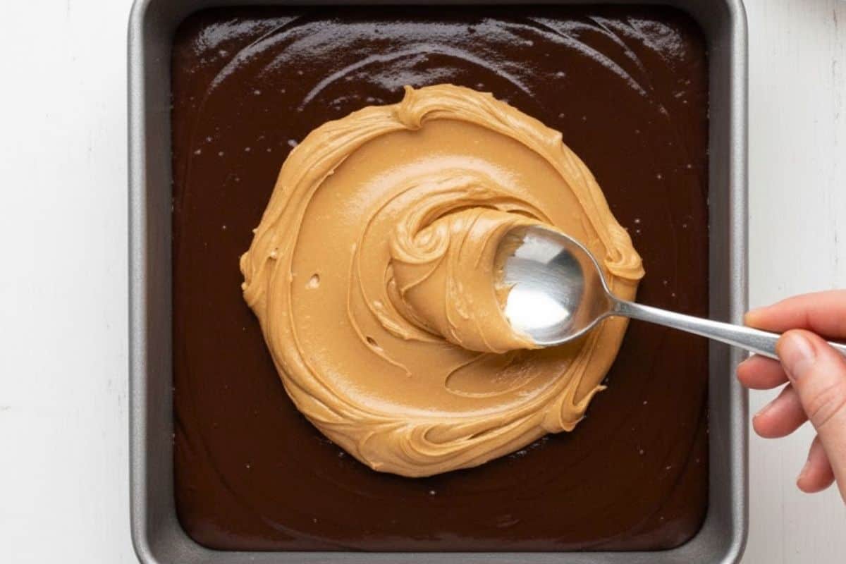 Spread half the batter into your pan, then spoon filling on top. Add remaining batter over the filling. - 8