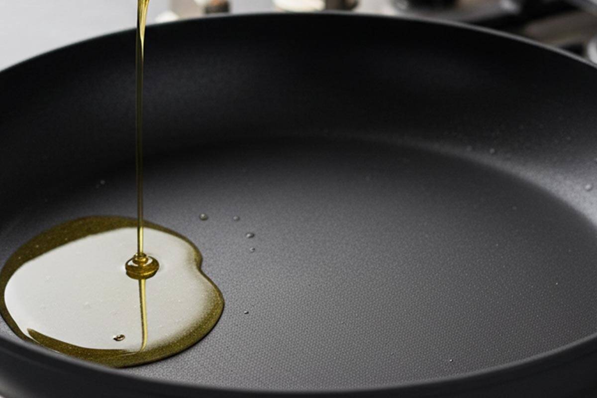 Pouring an oil in the pan.