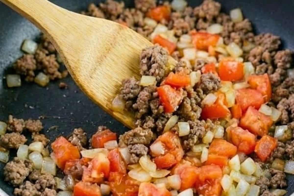 Add the mince and cook while breaking it up with a wooden spoon until fully browned. - 4