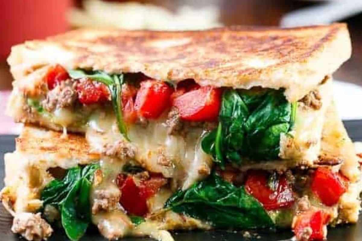 Spread avocado onto bread and layer with spinach, taco mince, tomatoes, cheese, salsa and optional yoghurt or sour cream. - 7