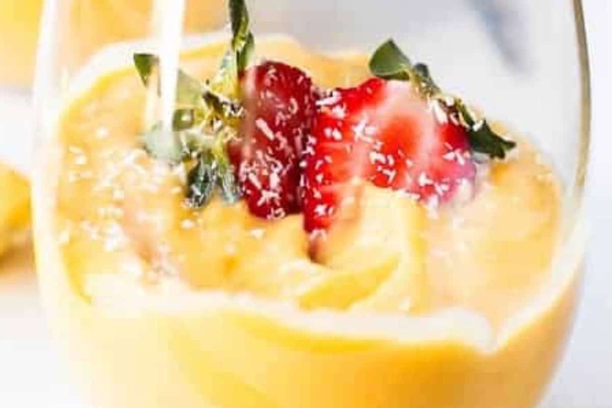 Pour the mixture into four glasses, add any extra mango on top if you like. - 6