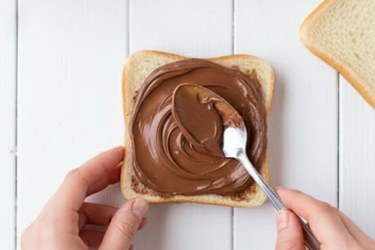Spread one teaspoon of Nutella on each bread and press the slices to form two sandwiches.