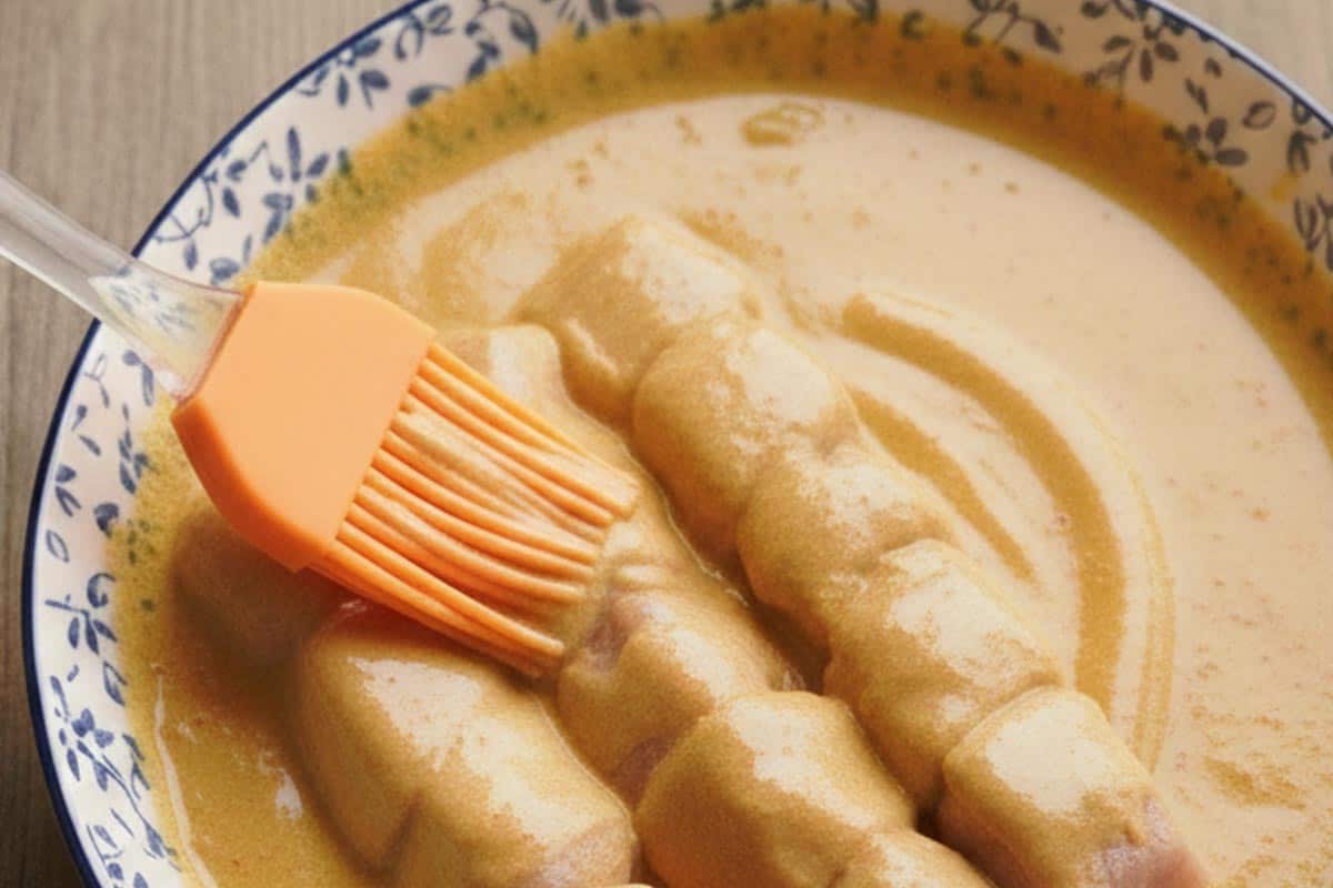 Coating the turkey skewers with the prepared marinade. - 6