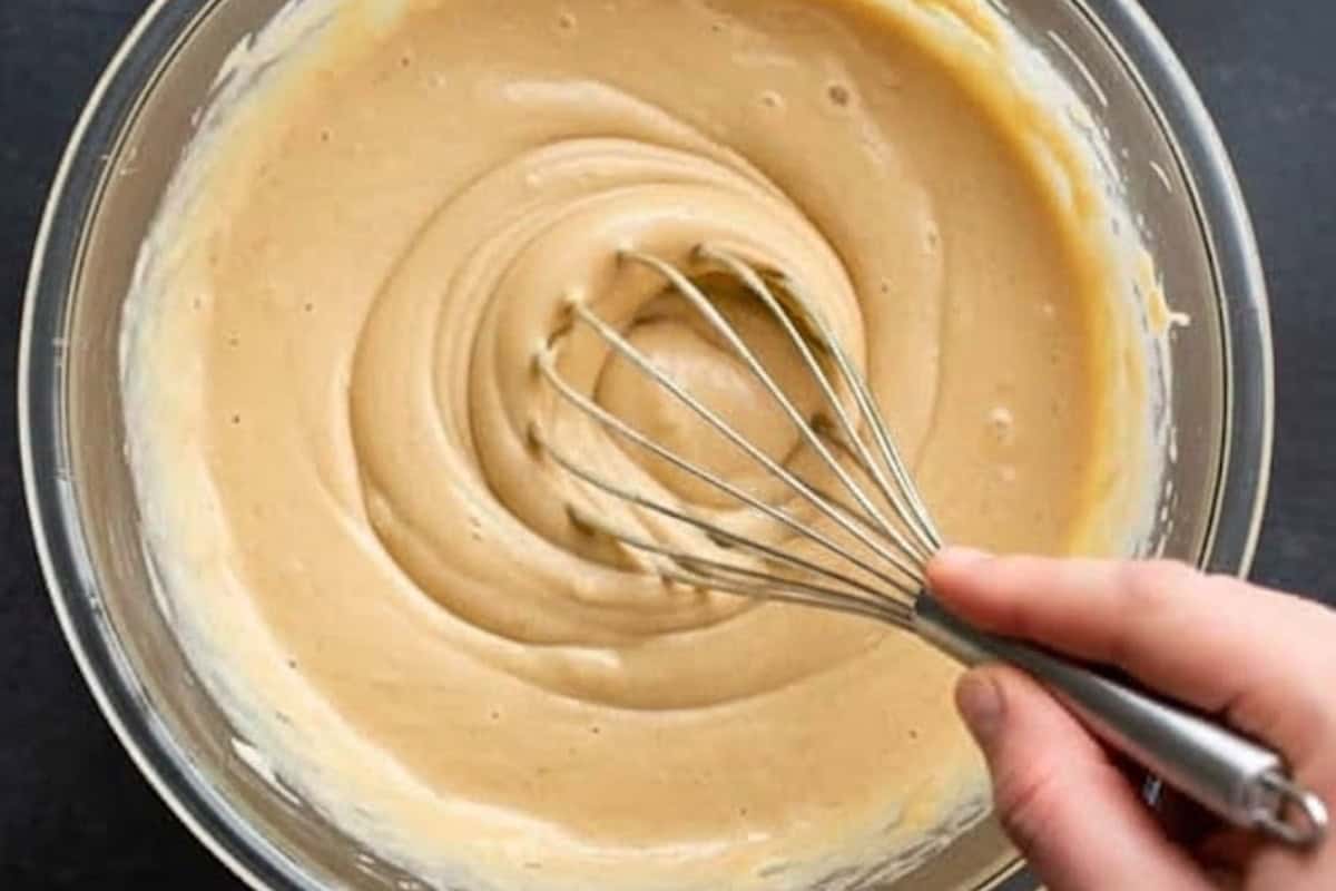 In a large bowl, combine the light butter, applesauce, brown sugar, and vanilla.