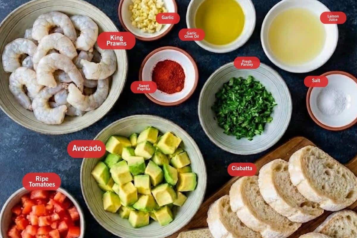 Flat lay photo of ingredient shot of king prawns, garlic, garlic olive oil, lemon juice, salt, ciabatta, fresh parsley, ripe tomatoes, avocado, sweet paprika - 2