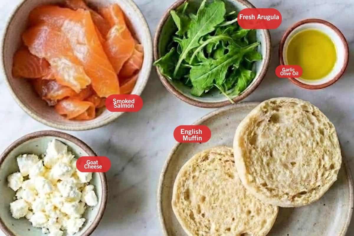 Flat lay photo of ingredient shot of goat cheese and smoke salmon English muffin
(smoked salmon, fresh arugula, garlic olive oil, English muffin, goat cheese) - 2