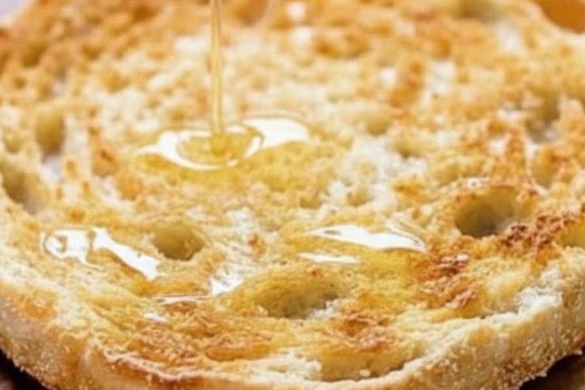 Toast the english muffin halves until golden and crisp, then drizzle lightly with the garlic olive oil - 3