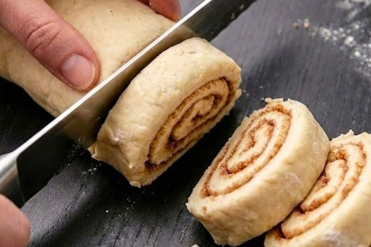 Roll from the long side into a tight log and place it seam side down. Use a sharp knife to slice the log into 14 even pieces - 8