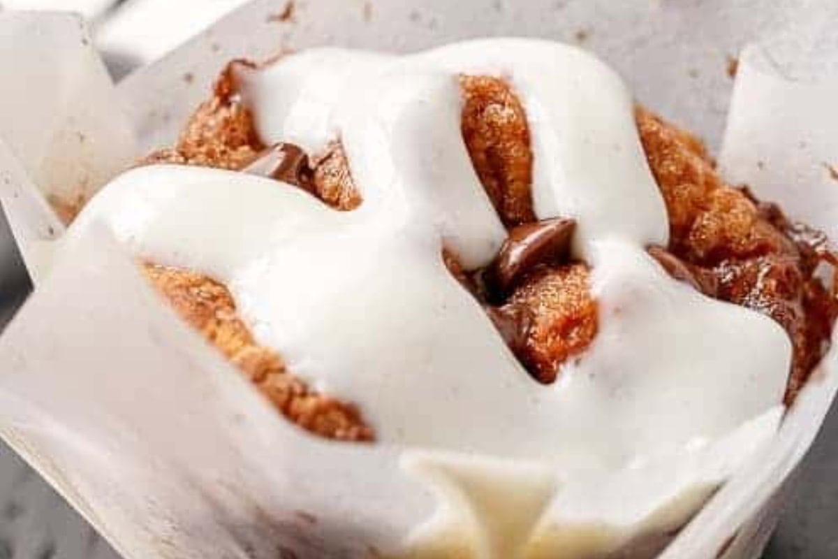 Blend the cream cheese, yogurt, powdered sugar, vanilla and lemon juice until smooth. Warm briefly in the microwave and drizzle over the cinnamon rolls - 10