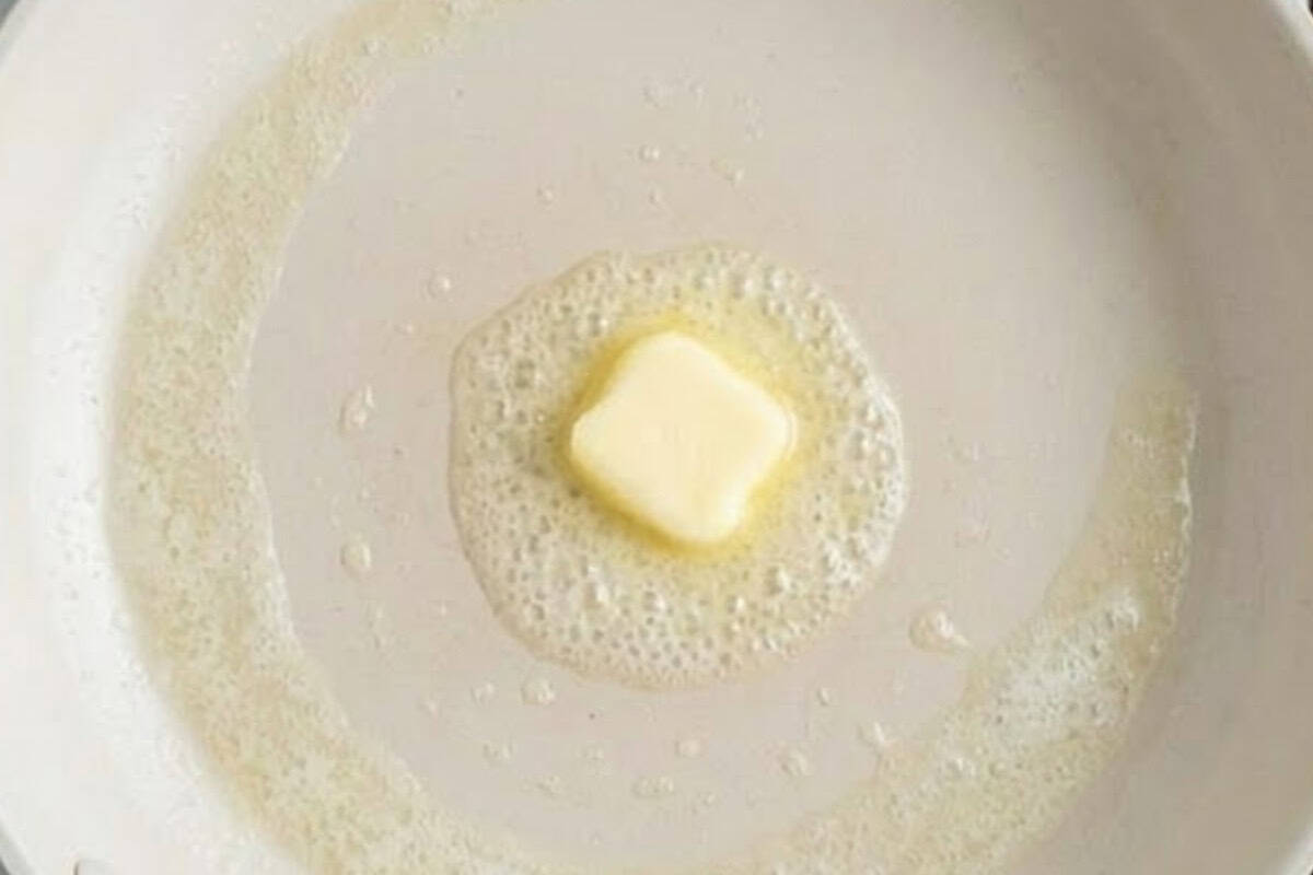 Warm a nonstick pan over low to medium heat and lightly grease with butter - 7