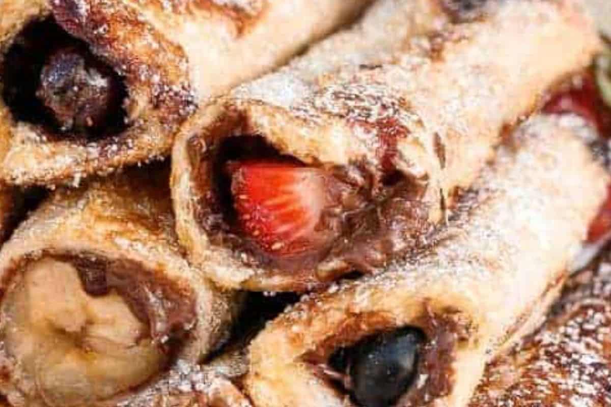 Once cooked through, roll the warm cannoli immediately in the sugar until fully coated - 10