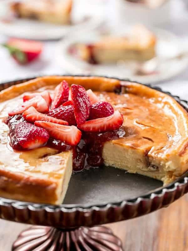 A slice missing from Strawberry Swirl Cheesecake
