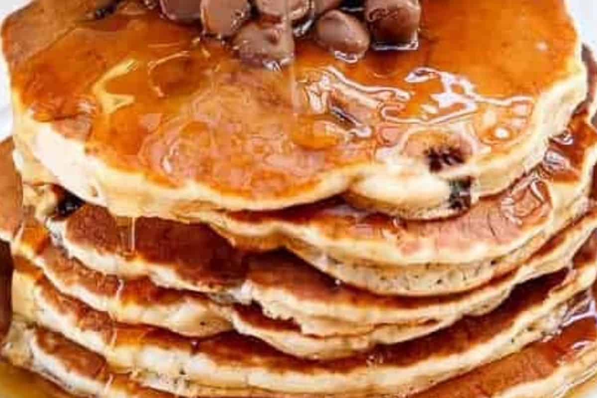 Heat a greased nonstick pan over low to medium heat, spoon in one quarter cup of batter, and cook until golden on both sides before serving with syrup. - 6