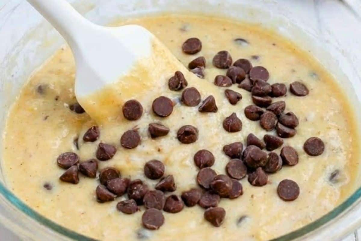 Pour in the milk and whisk until the mixture turns smooth and cohesive, then fold in the choc chips - 5