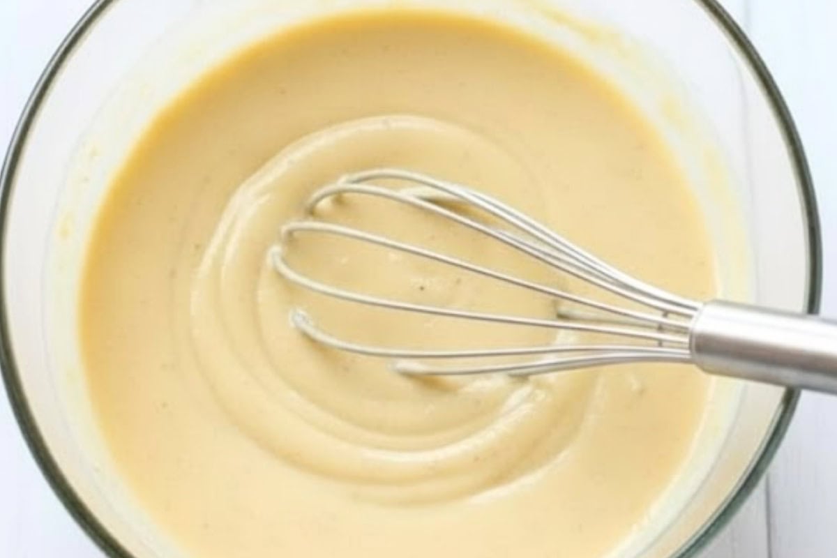 Combine the olive oil, dijon mustard, honey, milk, and a pinch of salt in a small bowl.  - 6