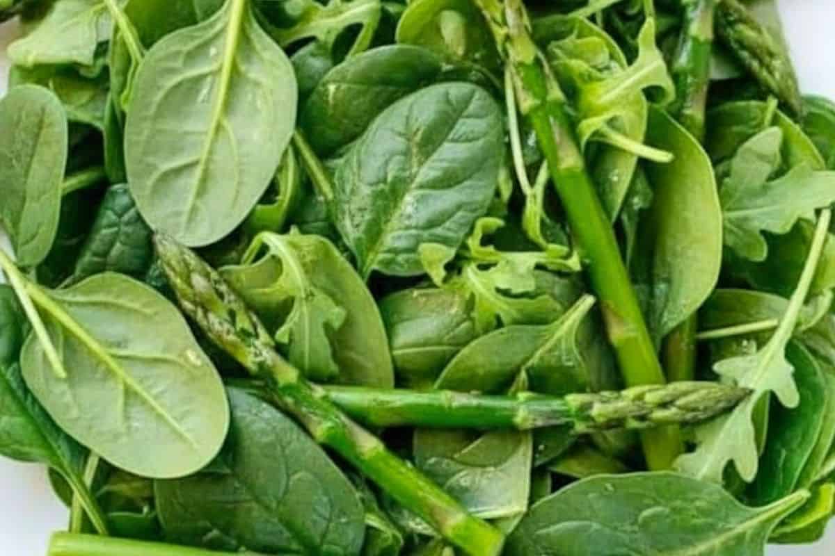 Spread the spinach, arugula, and asparagus on your serving plates. - 7