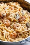 Creamy Shrimp Mushroom Linguine! Pasta, shrimp in a creamy low fat sauce without losing the creamy flavour? Of course! You won't miss the heavy cream! | cafedelites.com