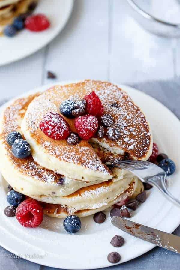 Fluffy Greek Yoghurt Mixed Berry Choc Chip Pancakes | https://cafedelites.com