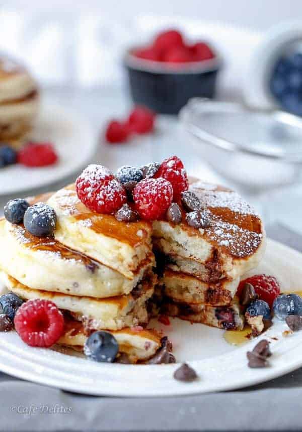 Fluffy Greek Yoghurt Mixed Berry Choc Chip Pancakes | https://cafedelites.com