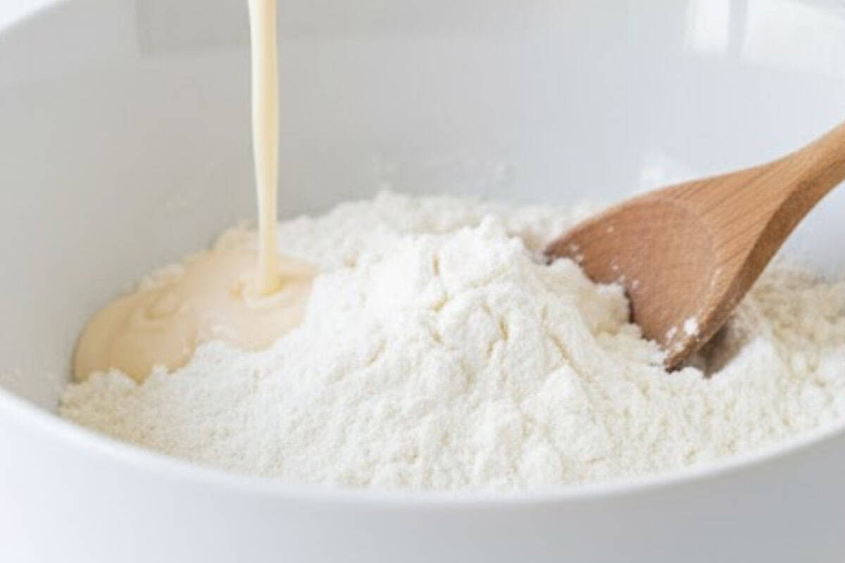 Pour wet mixture over the dry ingredients and gently stir with a wooden spoon until just combined.