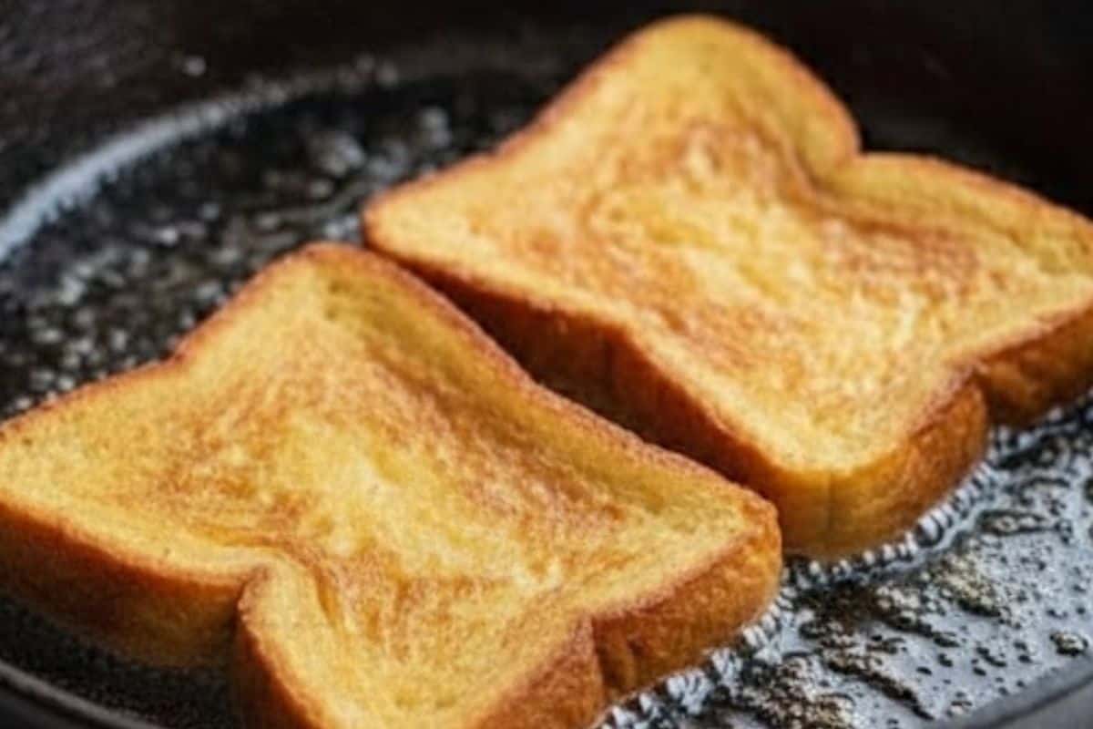 Heat a buttered pan over medium and fry the soaked bread until golden on both sides - 4