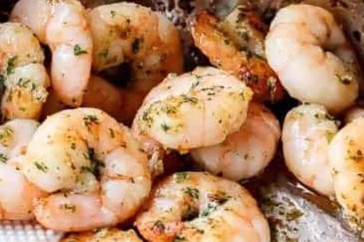 Add the marinated shrimp to the pan and sauté until they start to turn pink and slightly golden on the edges