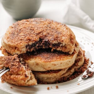 Nutella Stuffed Cinnamon Sugar Donut Pancakes stack on each other