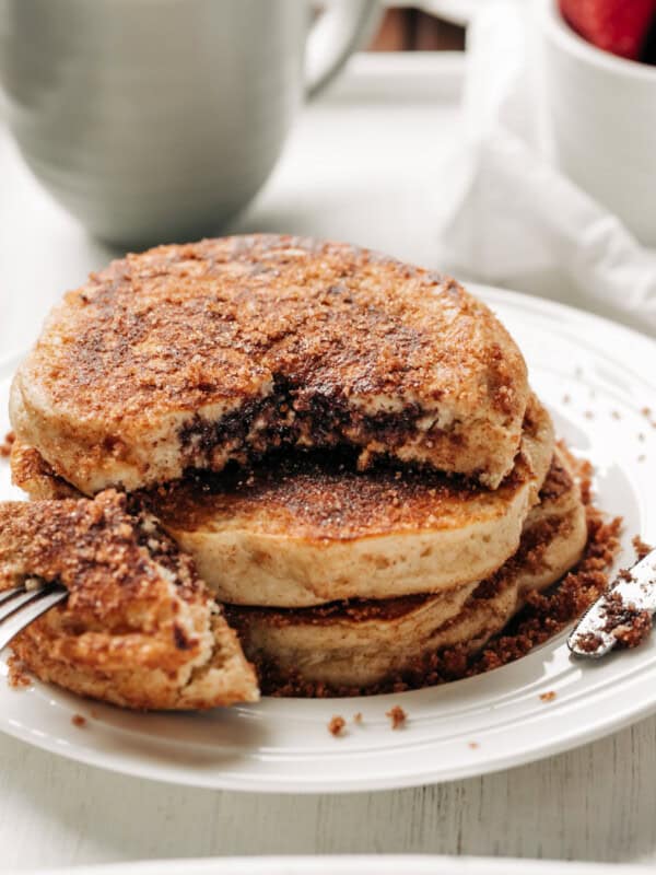 Nutella Stuffed Cinnamon Sugar Donut Pancakes stack on each other