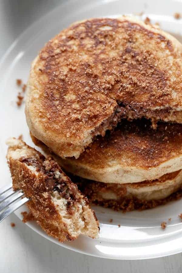 Nutella Stuffed Cinnamon Sugar Donut Pancakes | https://cafedelites.com